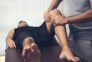 166544349 - Physiotherapist treating athlete male patient